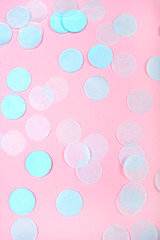 Mint confetti on pink background. Flat lay, top view.