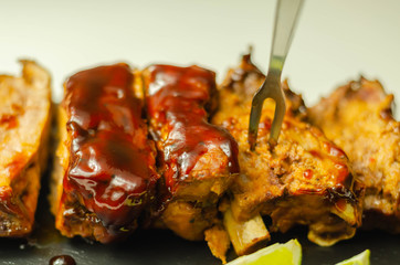 Pork ribs in a smoky flavour barbecue seasoning with a honey barbecue sauce