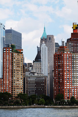 Manhattan downtown view with big skyscrapers, New York City, USA. Manhattan beautiful skyline panorama, NYC. Top of the buildings in financial district. Business background.