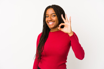 Young african american woman isolated cheerful and confident showing ok gesture.