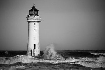 Black and white lighthouse in a storm