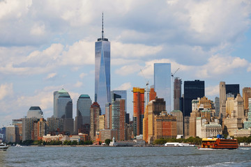 Manhattan skyline with Freedom Tower, New York, USA. World Trade Center 1. Manhattan downtown view with skyscrapers, NYC panorama. Top of the buildings in financial district. Business background.