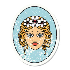 traditional distressed sticker tattoo of a maiden with crown of flowers
