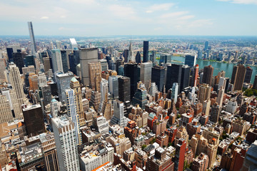 Manhattan midtown panorama view with big skyscrapers, New York City, USA. Manhattan beautiful skyline, NYC panorama. Top of the buildings in financial district. Business background.
