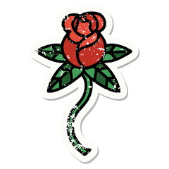 traditional distressed sticker tattoo of a flower