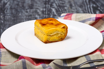 portion of puff pastry pie with cheese and butter, traditional Caucasian cuisine