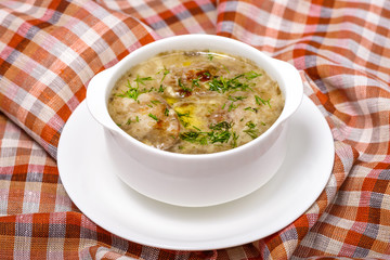 soup with mushrooms, meat and herbs. Restaurant serving