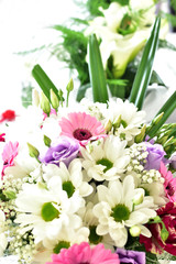 Close-up of wedding bouquet with pink and purple flowers.