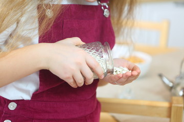 Female hands hold glass jars with beans and pasta