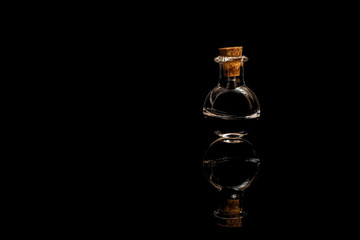 Obraz na płótnie Canvas Glass test tubes with liquid isolated on a black background.