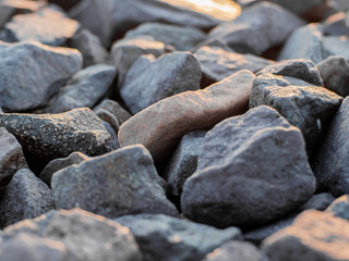 stones on the shore closeup. Stock photo. Beautiful rocks on the Sunset. Background bright colors