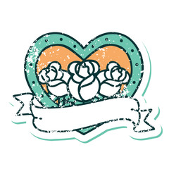 distressed sticker tattoo style icon of a heart and banner with flowers