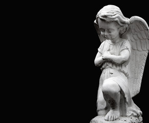 Little angel on black background. Annunciation and suffering
