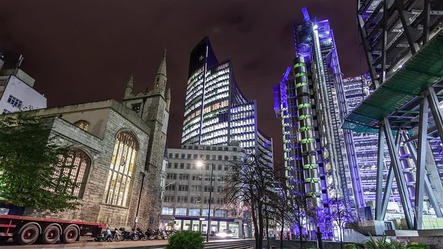 Time lapse view of the famous buildings in the Financial district of the City of London: Heron Tower, 99 Bishopsgate, LLoyd's building at night.