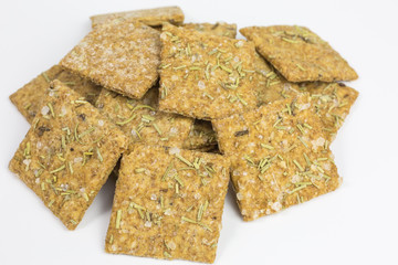 heap of crispy cracker with rosemary and sea salt