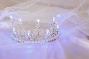Vintage tulle mint chiffon dress and diamond tiara with glowing pearls. Wedding concept. © tomertu