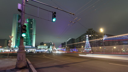 Fototapeta premium Buildings at New Arbat Street winter night timelapse. New Arbat is located in the central part of Moscow