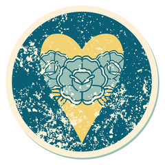 distressed sticker tattoo style icon of a heart and flowers