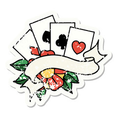 traditional distressed sticker tattoo of cards and banner