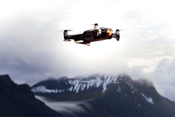 Fototapeta na wymiar Image of a drone flying over the iceland snowy mountains