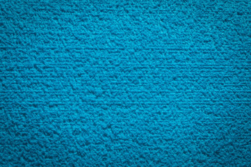 Fototapeta na wymiar textured fabric trendy blue surface for background and wallpaper with dark vignetting gradient
