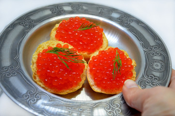  red caviar on a plate close-up