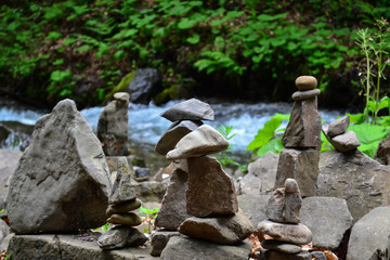 figures of stones on the shore of a mountain river, Shipot waterfall, Ukraine
