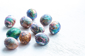 Cosmic coloring of Easter eggs on a light background.