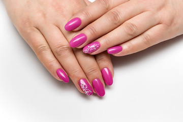 Fototapeta premium pink manicure on long oval nails with crystals and cobwebs