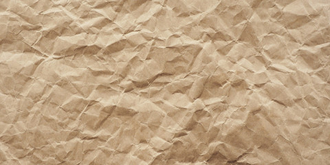 .background and texture crumpled craft paper. Many folds and creases. Drawing of light and shadow....