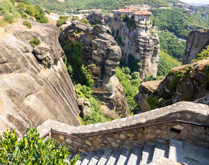 The Meteora - largest and most famous built complexes of Eastern Orthodox monasteries. Greek flag.