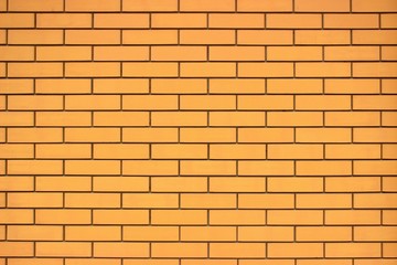  Yellow-brown brickwork. Smooth and dim background