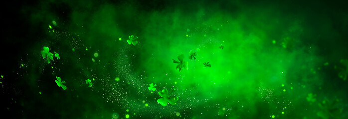 St. Patrick's Day abstract green background decorated with shamrock leaves. Patrick Day pub party celebrating. Abstract Border art design magic backdrop. Widescreen clovers on black with copy space. - 325455483