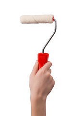 Hand holding paint roller for walls with red pen isolated on white background