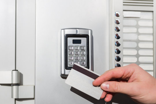 Man Hand Holding And Scanning Security Key Card On Electric Lock To Entry Private Building.