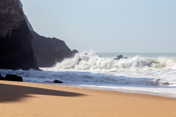 Ocean coast, moviment waves with foam. Wind power. Turquoise water.