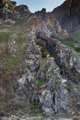 Rock cliff on ocean coast. the view from the down