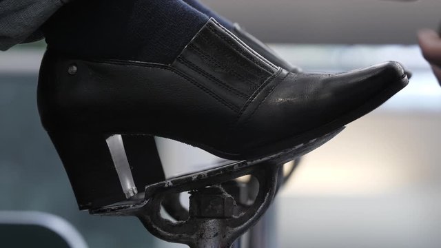 Business Woman With Black High Heels Gets a Shoe Shine While Traveling