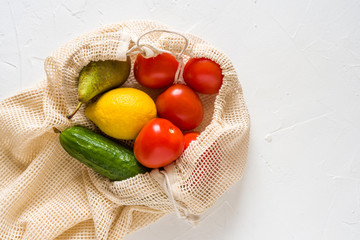 Fruits and vegetables in a cotton eco shopping bag. No waste concept