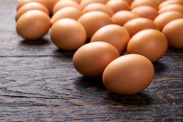 organic eggs on a black wooden table, with copy space.