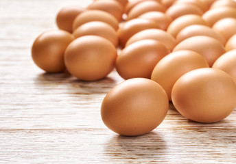 raw eggs on a white wooden table,close-up.