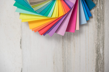 Colorful stack of sample swatches for paint or fabric in spectrum rainbow colors