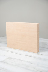 Blank wooden block or box on isolated white gray studio background