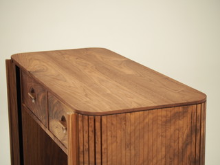 Original designer chest of drawers made of natural wood in its entirety, as well as its details on a white background, from different angles.