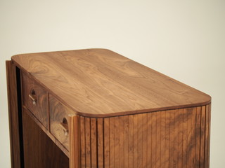 Original designer chest of drawers made of natural wood in its entirety, as well as its details on...