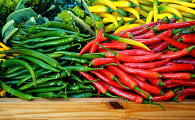 background of closeup red, yellow and green  hot peppers.