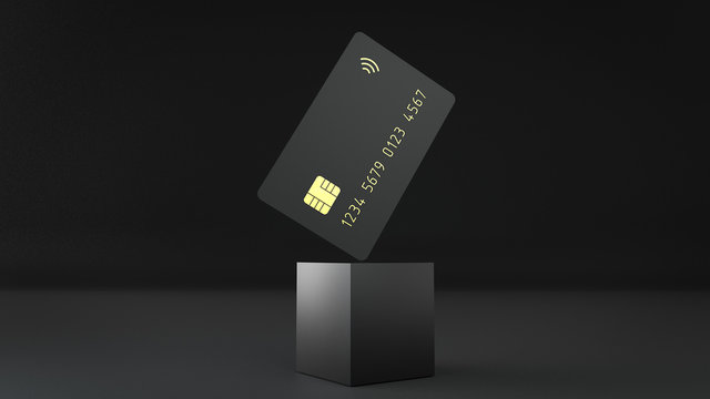 3d render of the black bank credit card on the cube isolated on a black background with gold detail embossing.