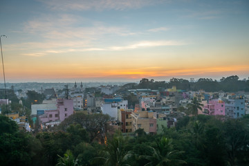View of Sunrise Over Bangalore Neighborhood With Dense Vegetation in the Foreground