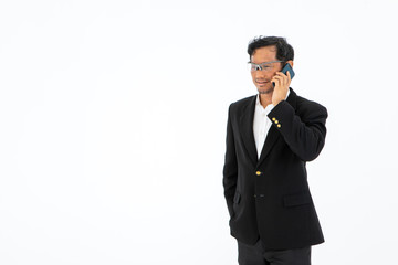 the asian business man lawyer standing and talking on mobile cellular Phone wearing formal suit isolated on white background with copy space 