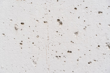 Texture of a concrece wall with small holes, stock photo